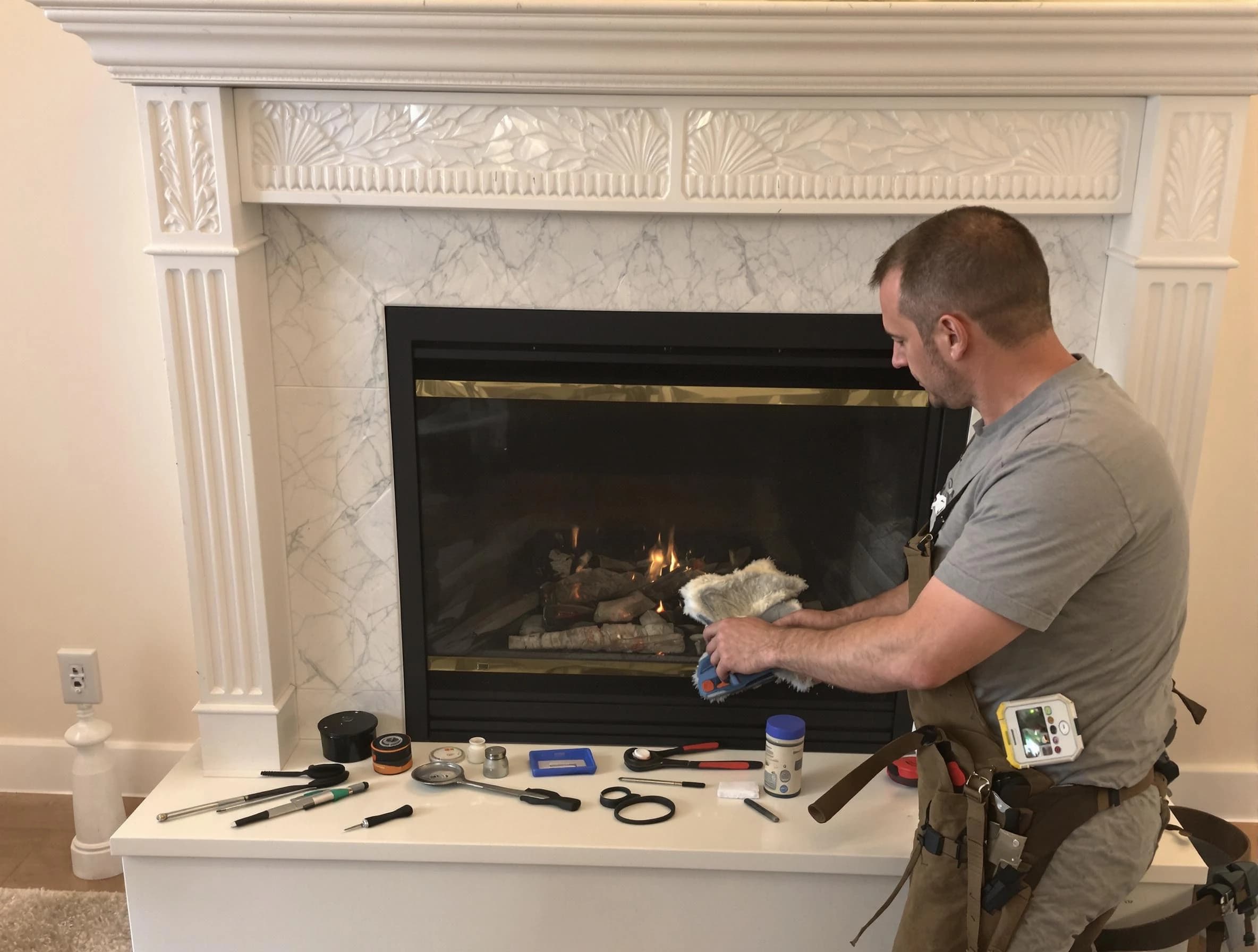 New Kensington Chimney Sweep performing fireplace maintenance in New Kensington, PA